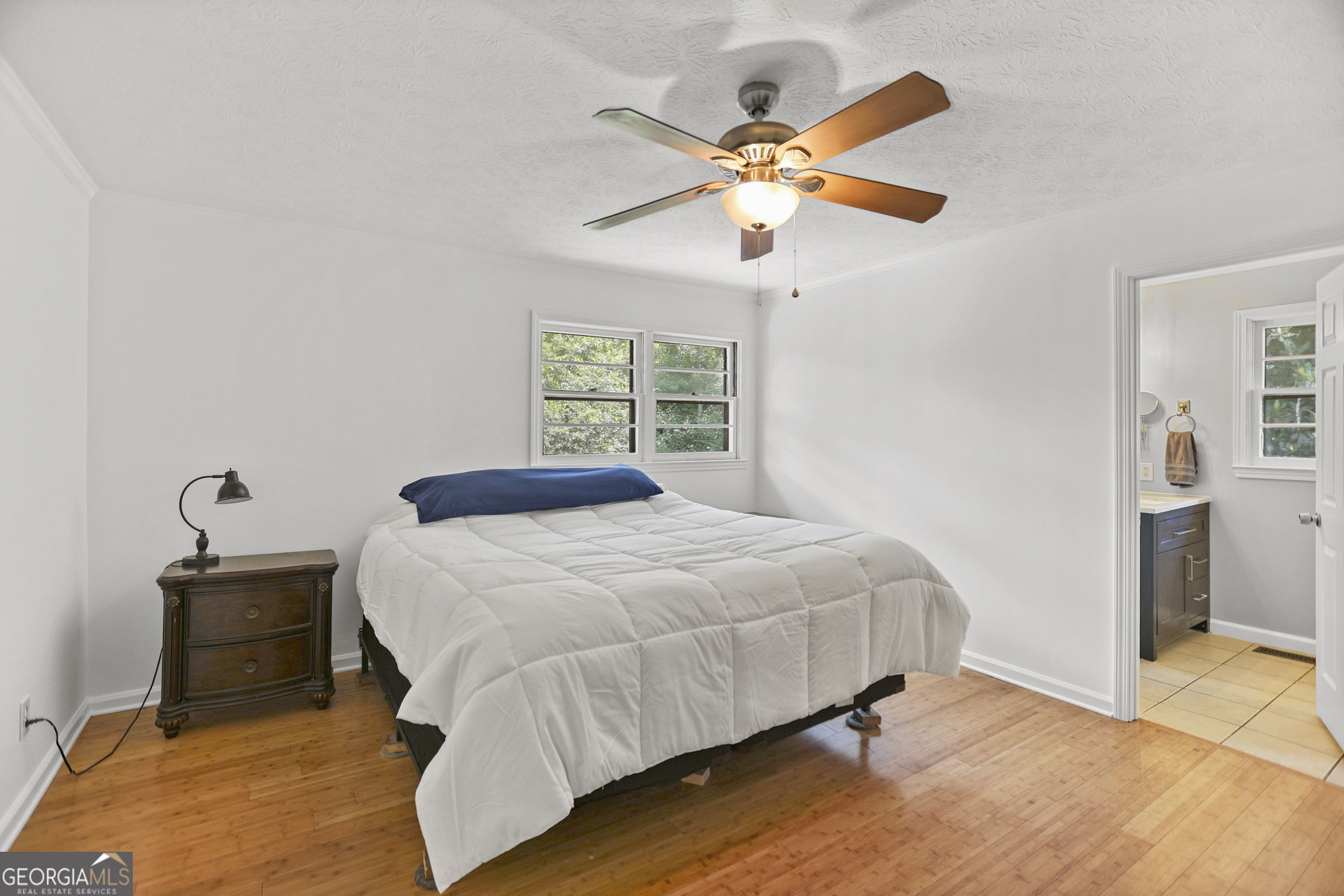 12 Conner Drive Newnan, GA 30263 - Photo 12 of 28 a bedroom with a bed and a chandelier