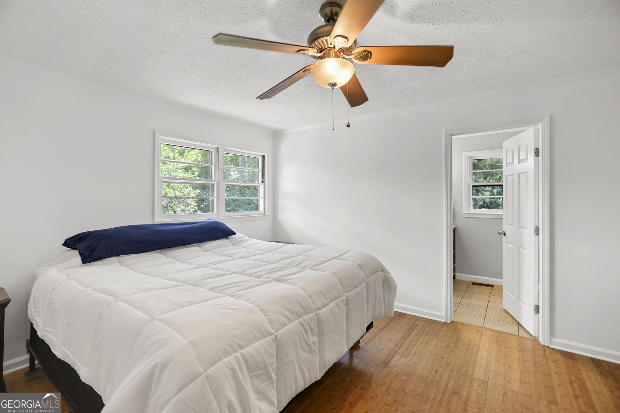 12 Conner Drive Newnan, GA 30263 - Photo 13 of 28 a bedroom with a bed and a chandelier