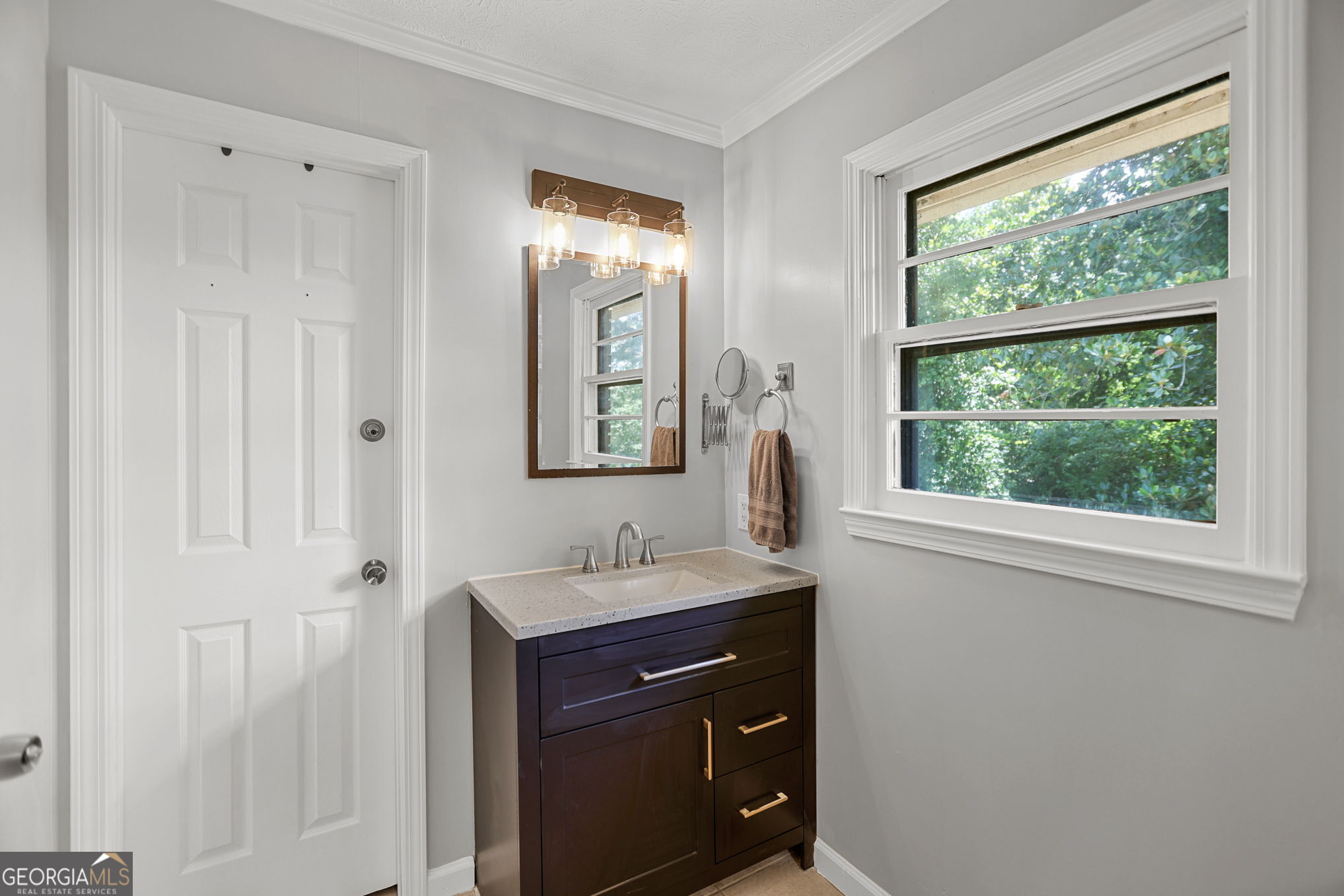 12 Conner Drive Newnan, GA 30263 - Photo 15 of 28 a bathroom with a sink and a mirror