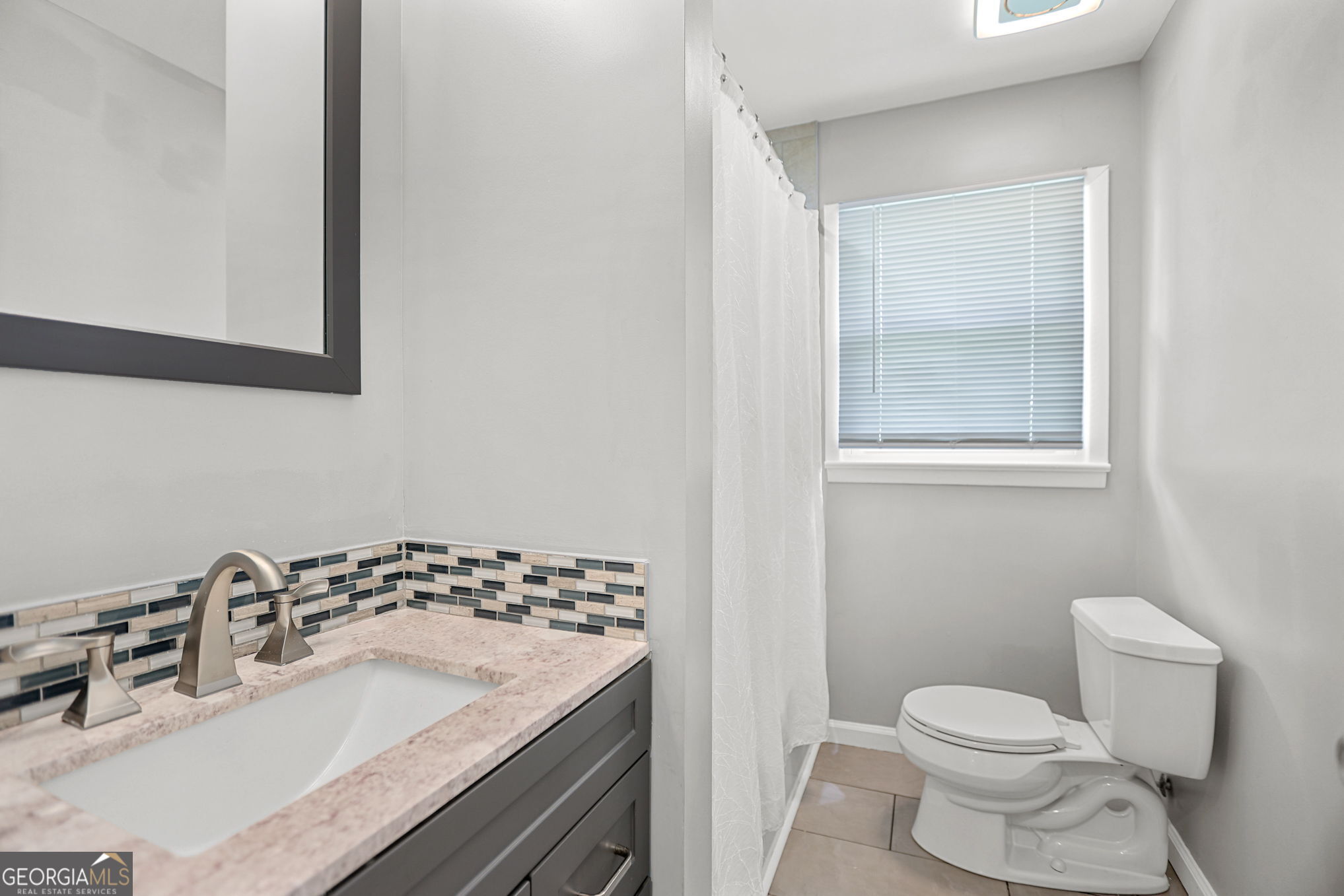 12 Conner Drive Newnan, GA 30263 - Photo 17 of 28 a bathroom with a sink toilet and mirror