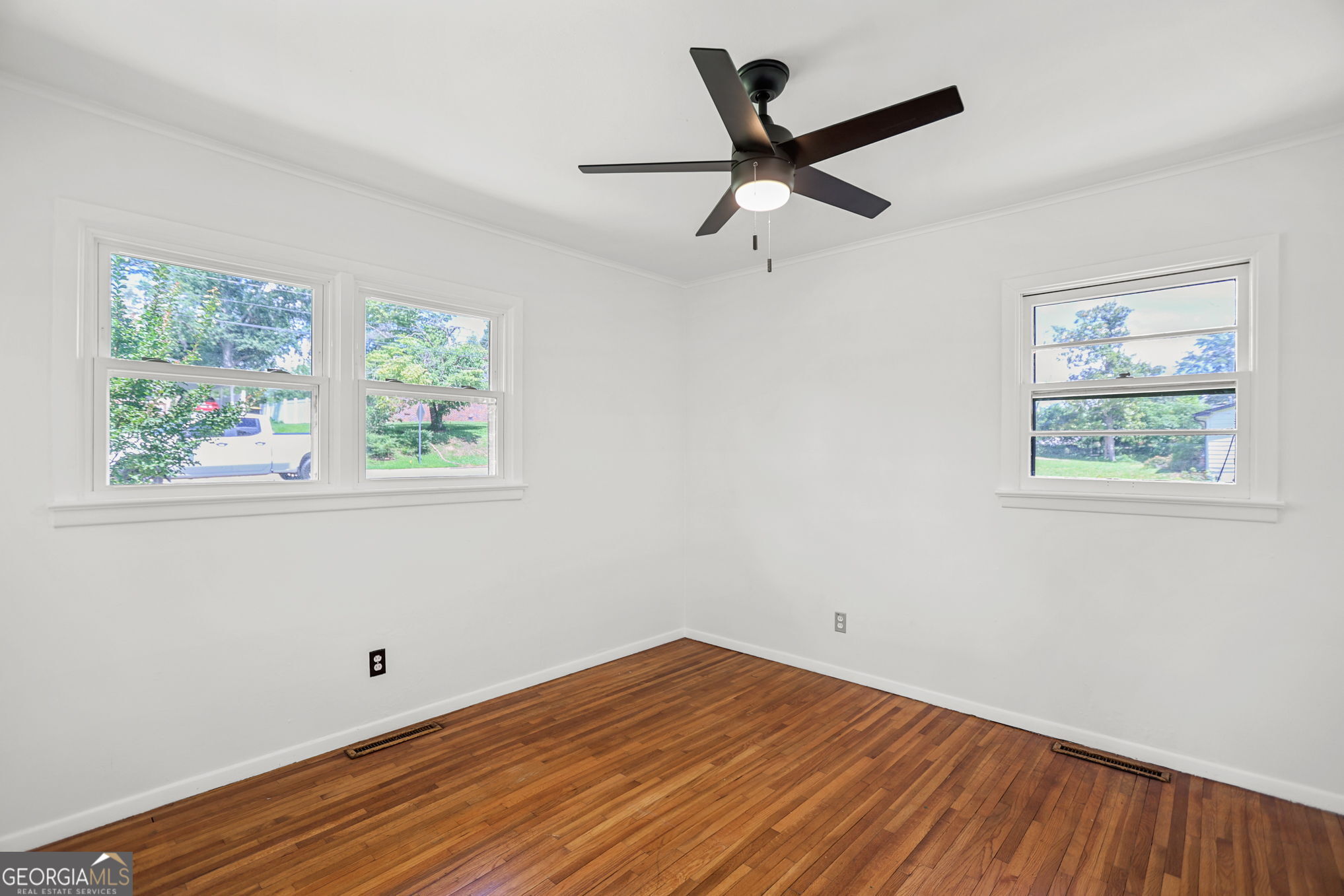 12 Conner Drive Newnan, GA 30263 - Photo 21 of 28 a view of empty room with wooden floor and fan