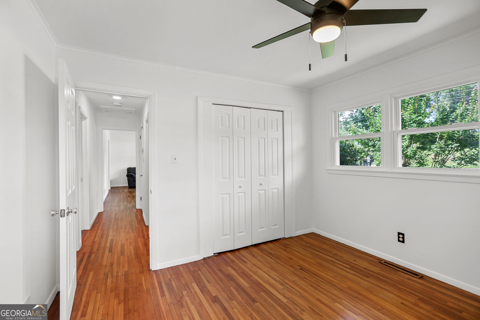 12 Conner Drive Newnan, GA 30263 - Photo 22 of 28 a view of a livingroom with wooden floor and a ceiling fan