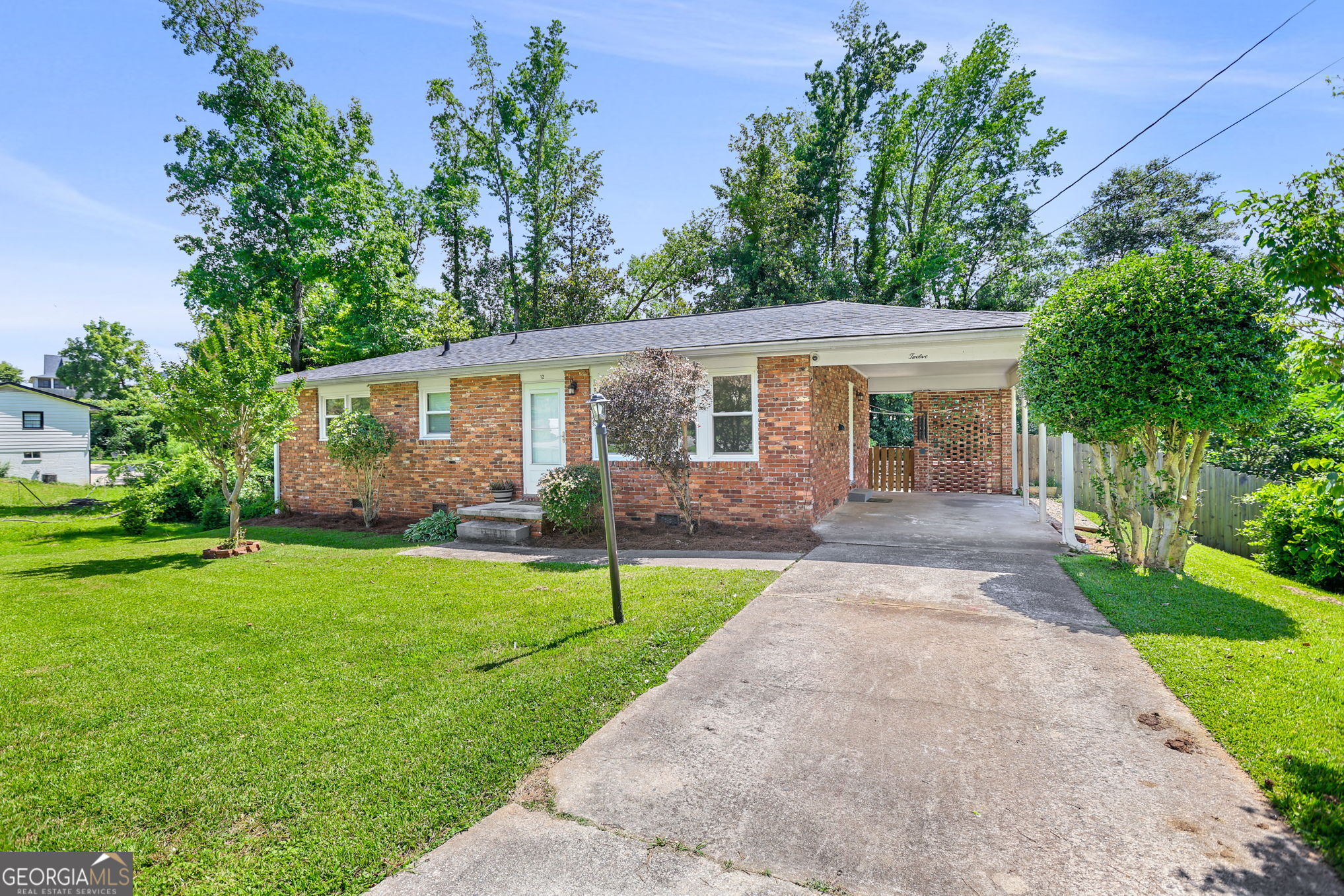 12 Conner Drive Newnan, GA 30263 - Photo 3 of 28 a front view of house with yard and green space