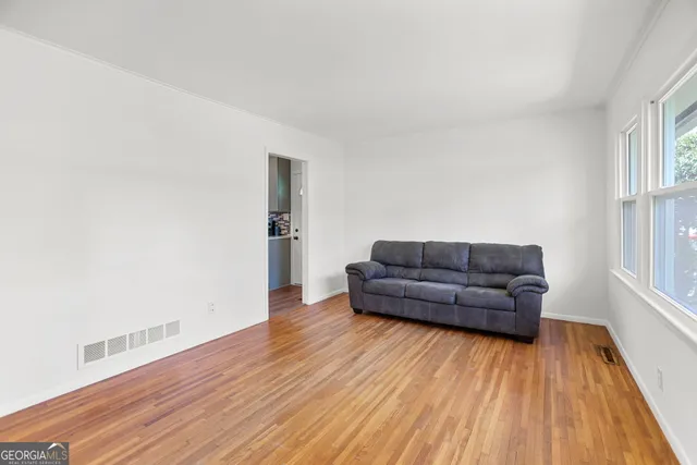 a living room with a flat screen tv and a fireplace