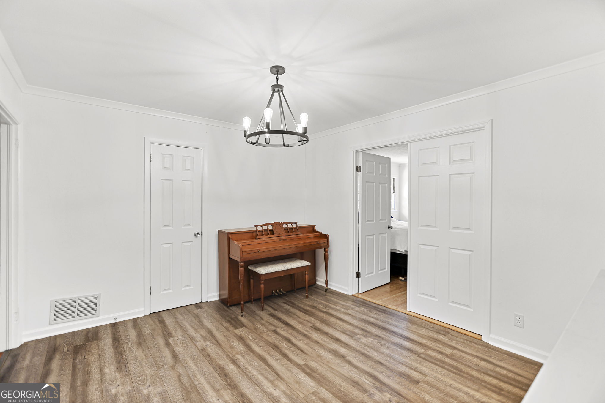 12 Conner Drive Newnan, GA 30263 - Photo 10 of 28 a view of a livingroom with wooden floor and furniture