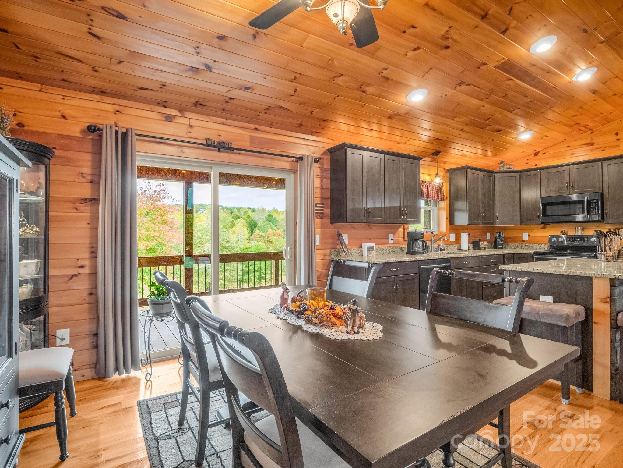 653 Moonlight Pass Union Mills, NC 28167 - Photo 13 of 44 a dining room with furniture a large window and a table