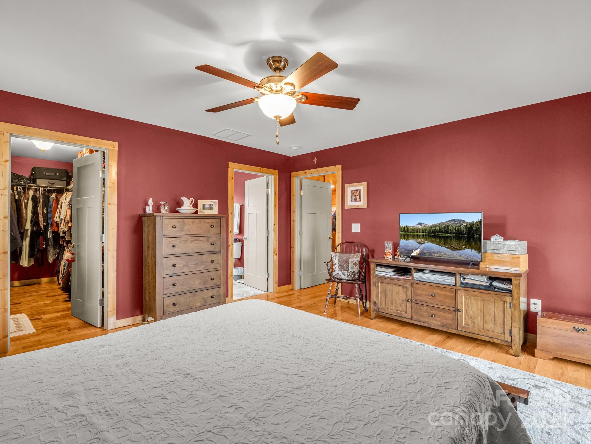 653 Moonlight Pass Union Mills, NC 28167 - Photo 16 of 44 a bedroom with furniture and a flat screen tv
