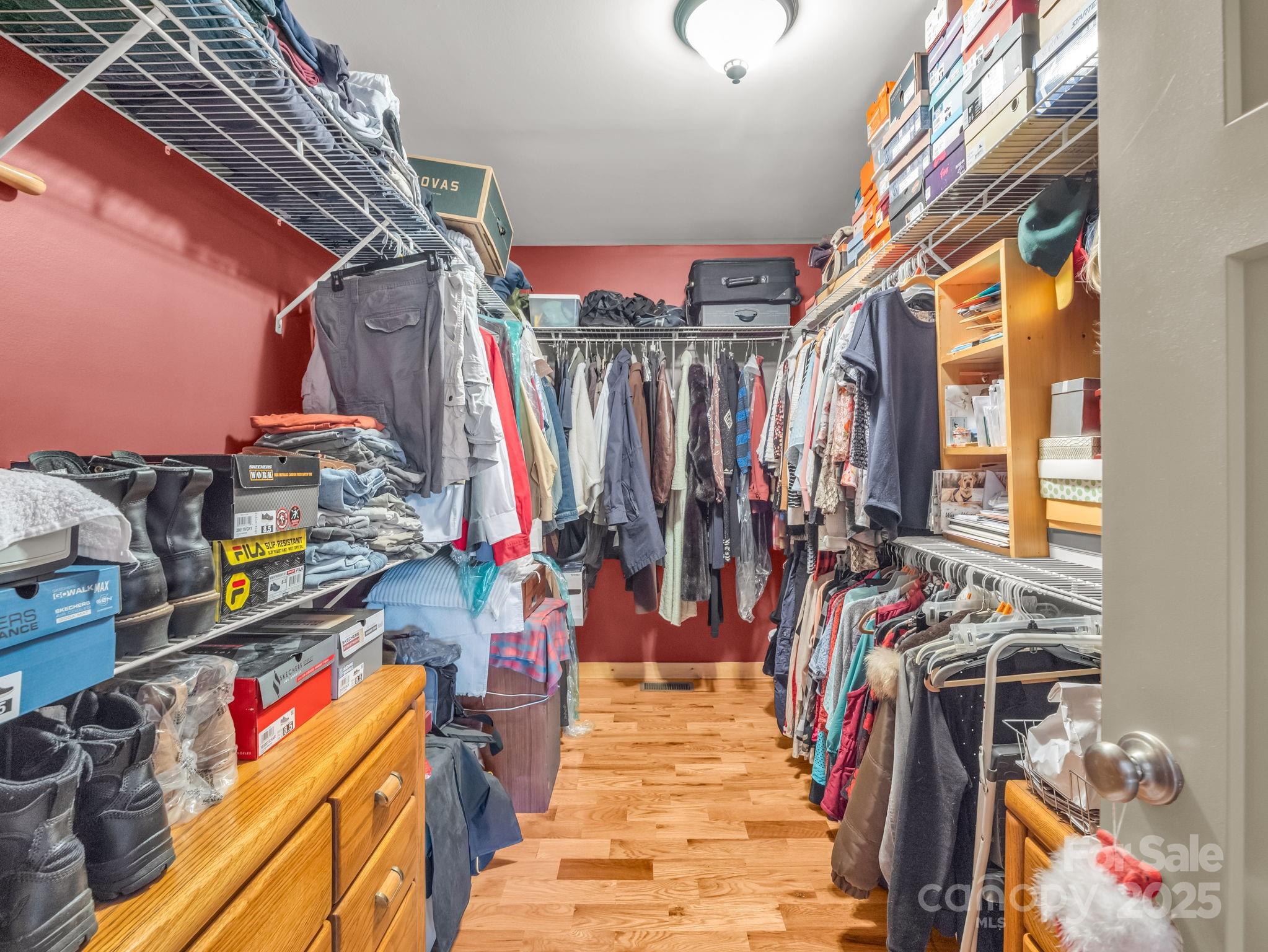 653 Moonlight Pass Union Mills, NC 28167 - Photo 18 of 44 a view of walk in closet with clothes