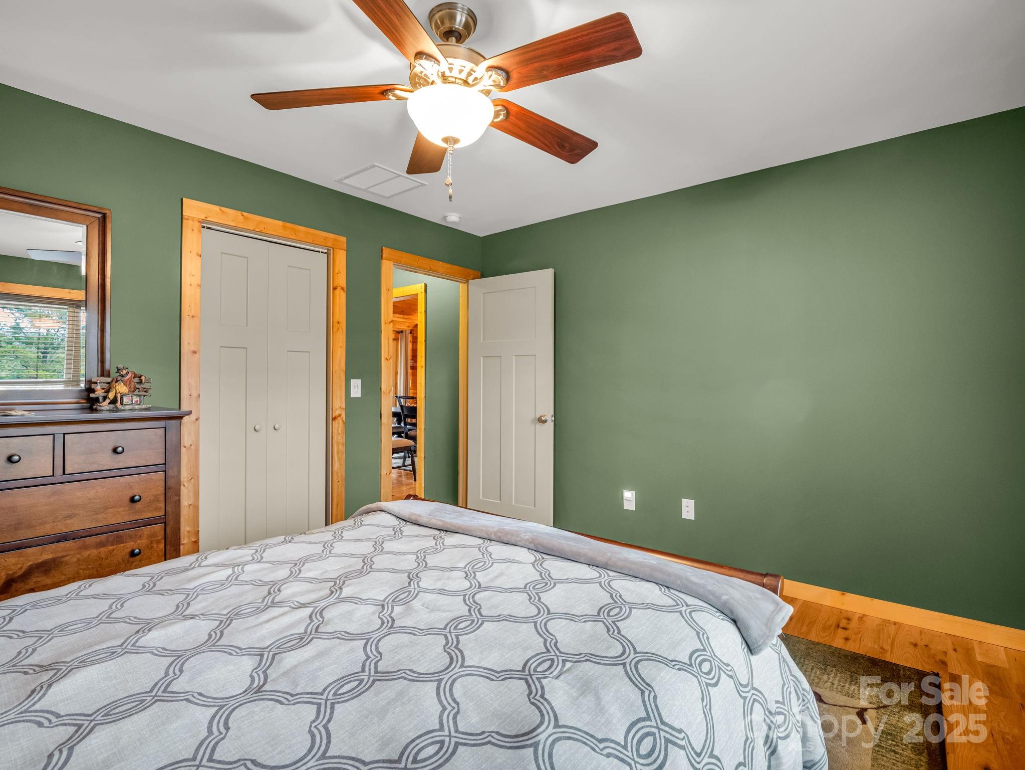 653 Moonlight Pass Union Mills, NC 28167 - Photo 20 of 44 a bedroom with a bed and a chandelier
