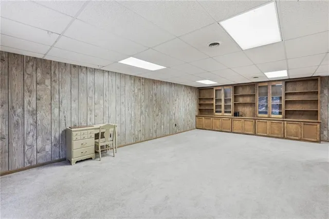 a view of an empty room with a fireplace