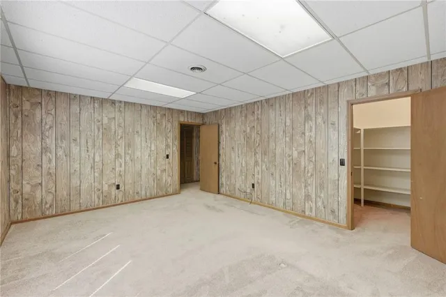 a view of an empty room with a cabinet