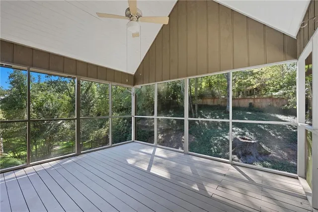 a view of a deck with wooden floor and outdoor space