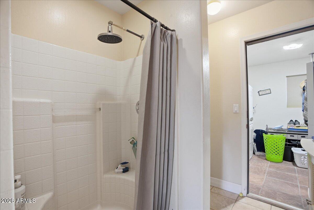 1414 West Ocotillo Road San Tan Valley, AZ 85140 - Photo 22 of 62 a bathroom with a shower and a sink