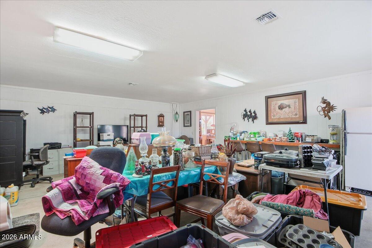 1414 West Ocotillo Road San Tan Valley, AZ 85140 - Photo 25 of 62 a room with furniture toys and a flat screen tv