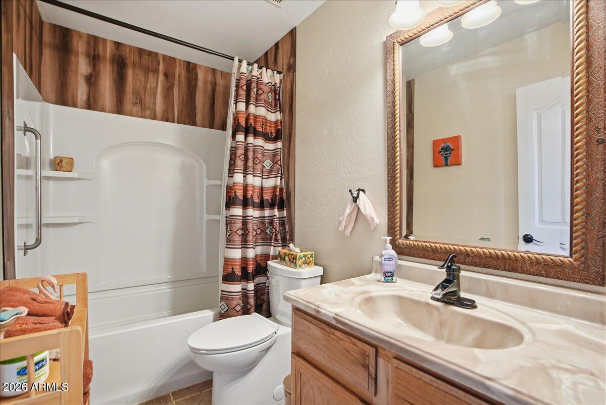 1414 West Ocotillo Road San Tan Valley, AZ 85140 - Photo 26 of 62 a bathroom with a sink toilet and shower