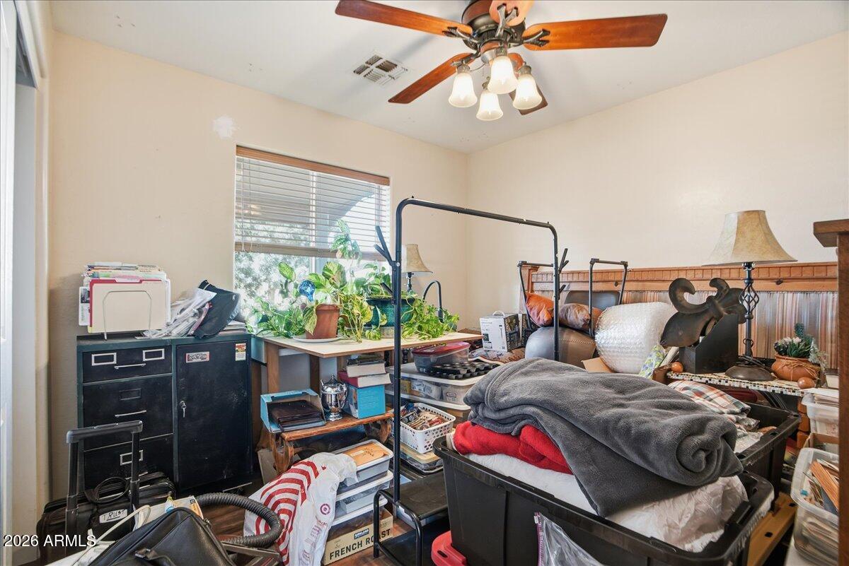 1414 West Ocotillo Road San Tan Valley, AZ 85140 - Photo 27 of 62 a bedroom with a bed and wooden floor