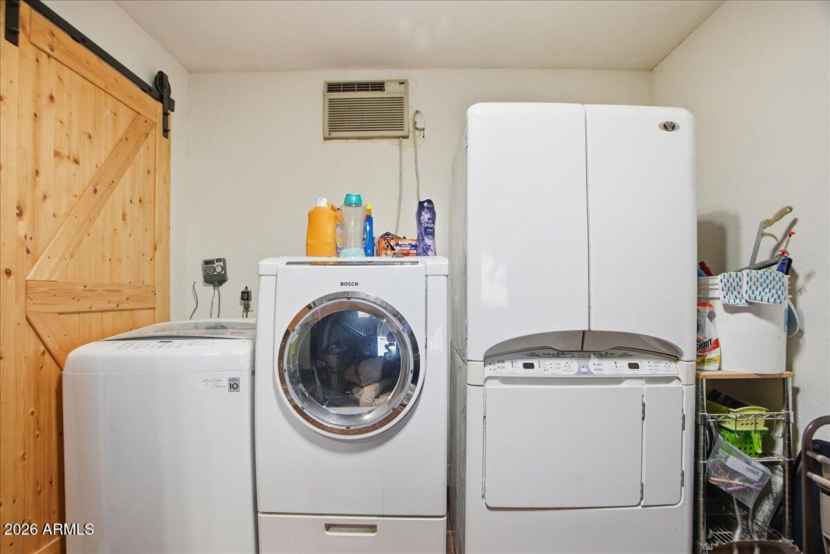 1414 West Ocotillo Road San Tan Valley, AZ 85140 - Photo 28 of 62 a utility room with dryer and washer