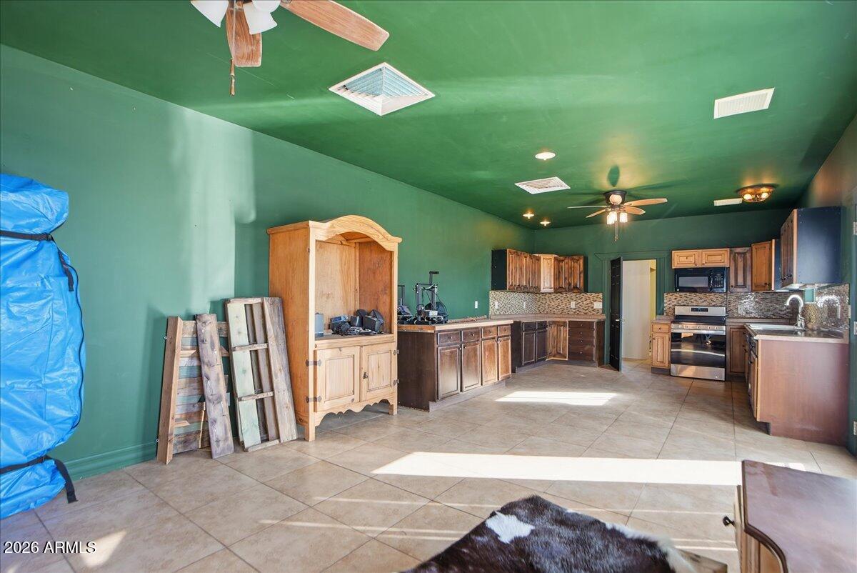 1414 West Ocotillo Road San Tan Valley, AZ 85140 - Photo 33 of 62 a living room with lots of furniture and a large window