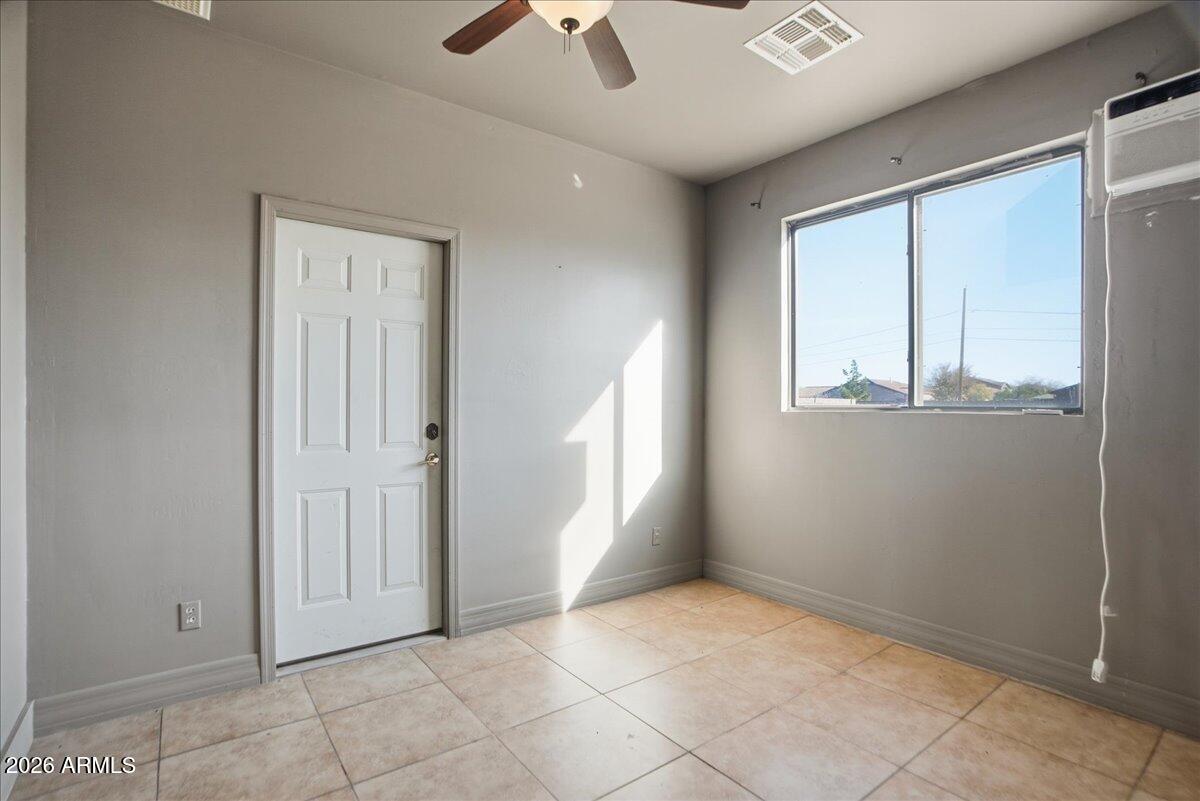 1414 West Ocotillo Road San Tan Valley, AZ 85140 - Photo 37 of 62 an empty room with windows and closet