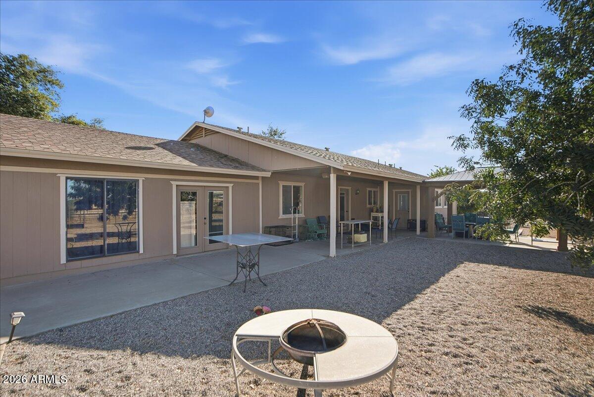 1414 West Ocotillo Road San Tan Valley, AZ 85140 - Photo 43 of 62 a backyard of a house with yard barbeque oven and outdoor seating