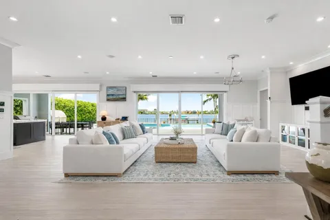 a view of a swimming pool with a table and chairs