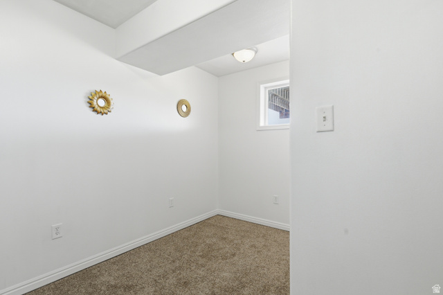830 North Stone Road Snowville, UT 84336 - Photo 22 of 69 Empty room featuring baseboards and carpet