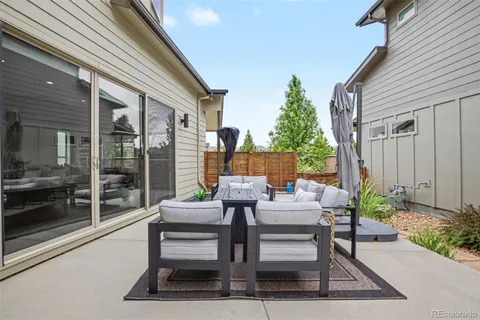 a outdoor space with a couch and the potted plant