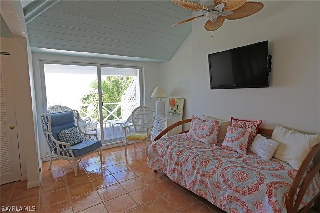 508 Useppa Island Bokeelia, FL 33922 - Photo 15 of 22 a bedroom with a bed and a flat screen tv