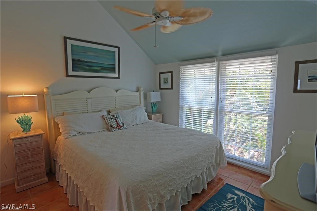 508 Useppa Island Bokeelia, FL 33922 - Photo 19 of 22 a bedroom with a large bed and a window
