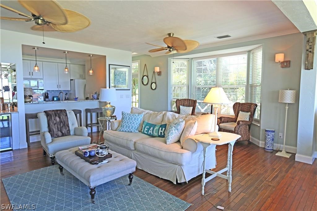 508 Useppa Island Bokeelia, FL 33922 - Photo 3 of 22 a living room with furniture a table and wooden floor