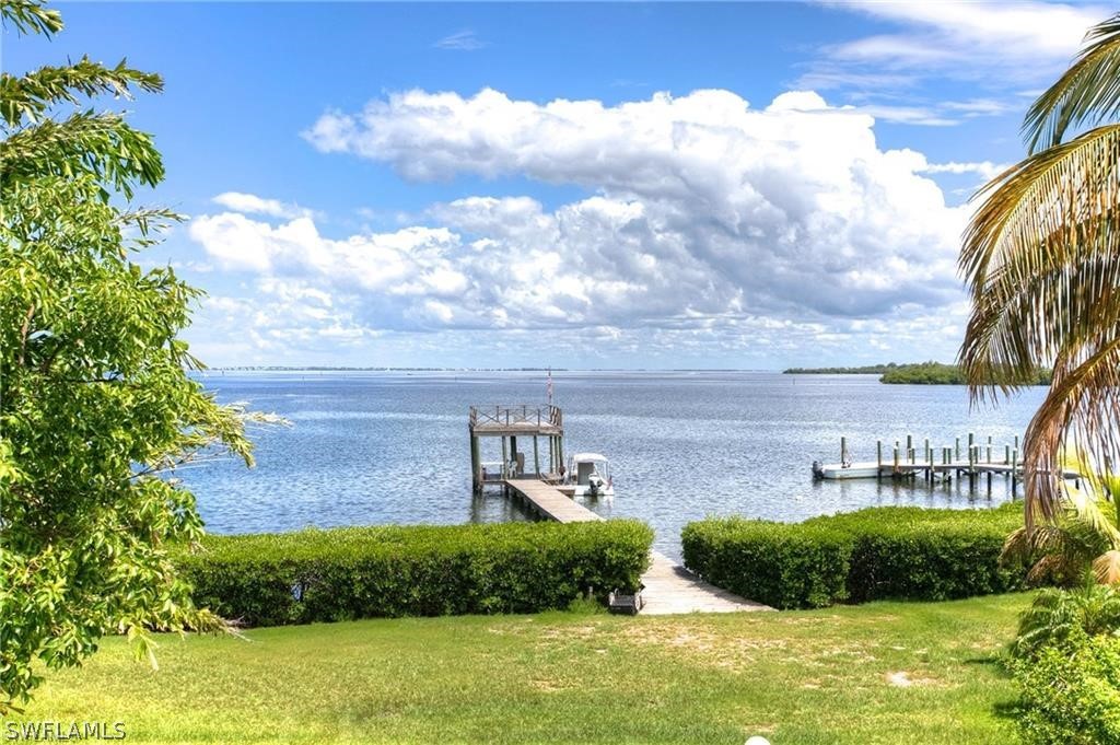 508 Useppa Island Bokeelia, FL 33922 - Photo 5 of 22 a view of a lake with a building in the background