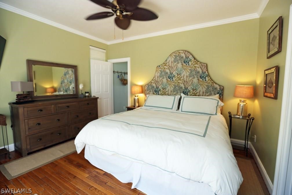 508 Useppa Island Bokeelia, FL 33922 - Photo 10 of 22 a bedroom with a bed and a dresser