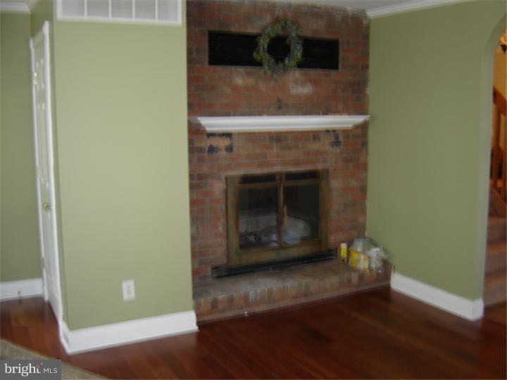 368 Harmony Road Bridgeton, NJ 08302 - Photo 8 of 15 a living room with a fireplace