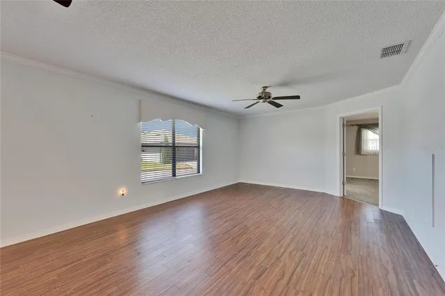 a kitchen with stainless steel appliances granite countertop a stove and a white cabinets