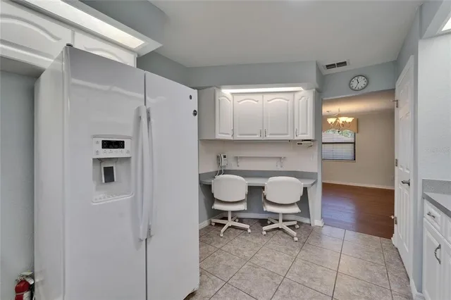 an aerial view of a house with garden space and street view