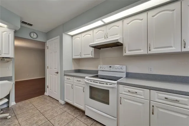 an aerial view of a houses with outdoor space and street view