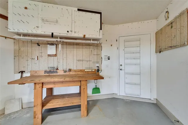 an aerial view of a city with lots of residential buildings lake and ocean view