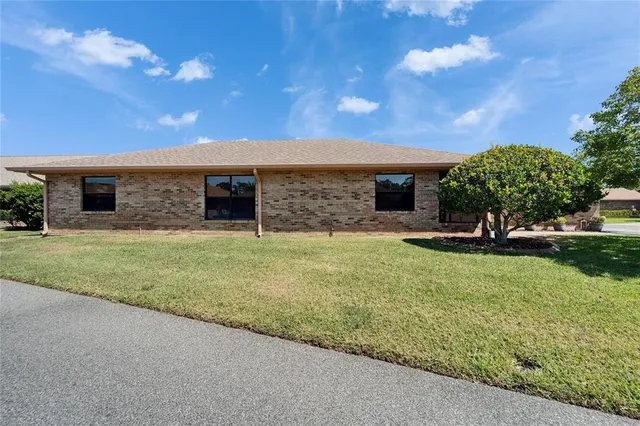 an aerial view of a house with a lake view