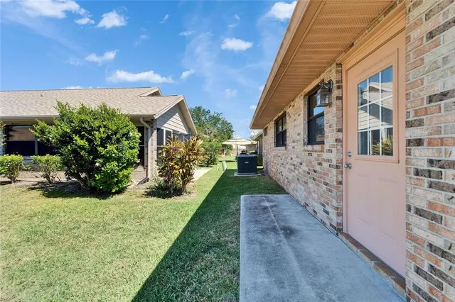 an aerial view of a house with a lake view