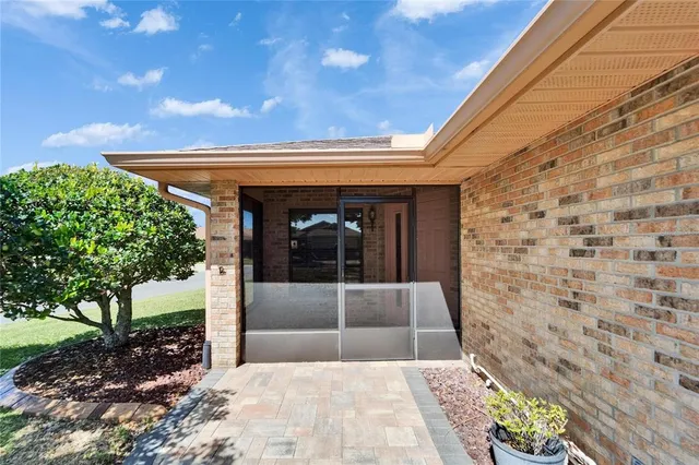 an empty room with closet and a ceiling fan