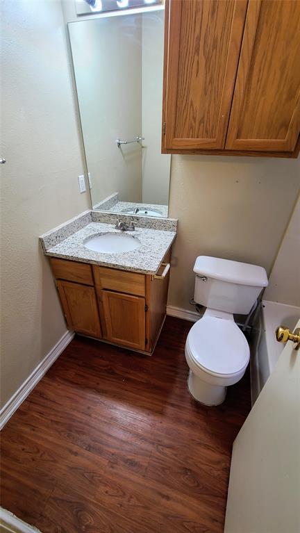 1907 Robbins Place, Unit 103 Austin, TX 78705 - Photo 4 of 5 Bathroom with vanity and dark wood finished floors