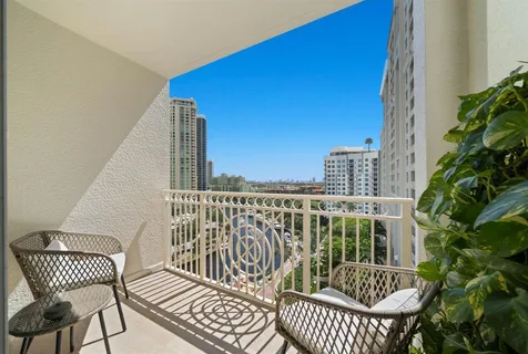 a view of a balcony with furniture