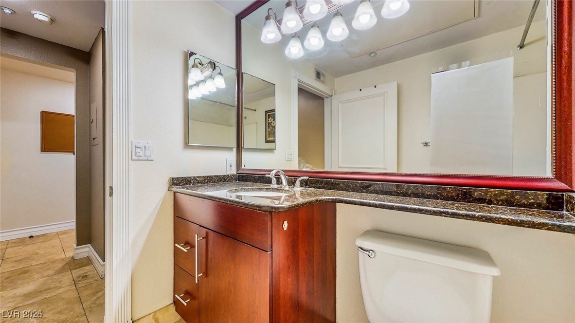 260 East Flamingo Road, Unit 229 Las Vegas, NV 89169 - Photo 18 of 31 Bathroom with vanity and light tile patterned flooring