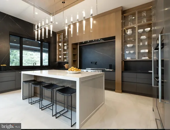 a view of kitchen with cabinets and window