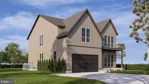 a front view of a house with a garden and plants