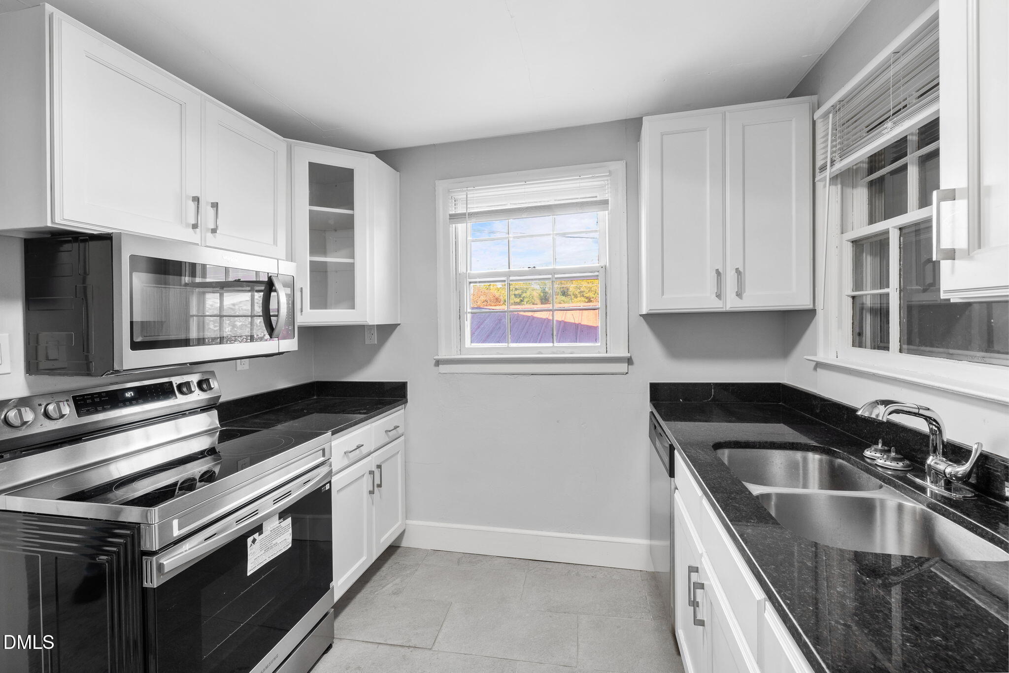 109 Lincoln Court Raleigh, NC 27610 - Photo 11 of 27 a kitchen with granite countertop a sink and steel appliances