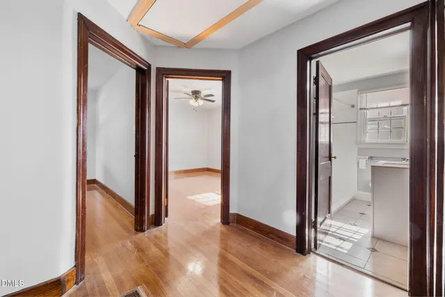 a view of a bathroom from a hallway