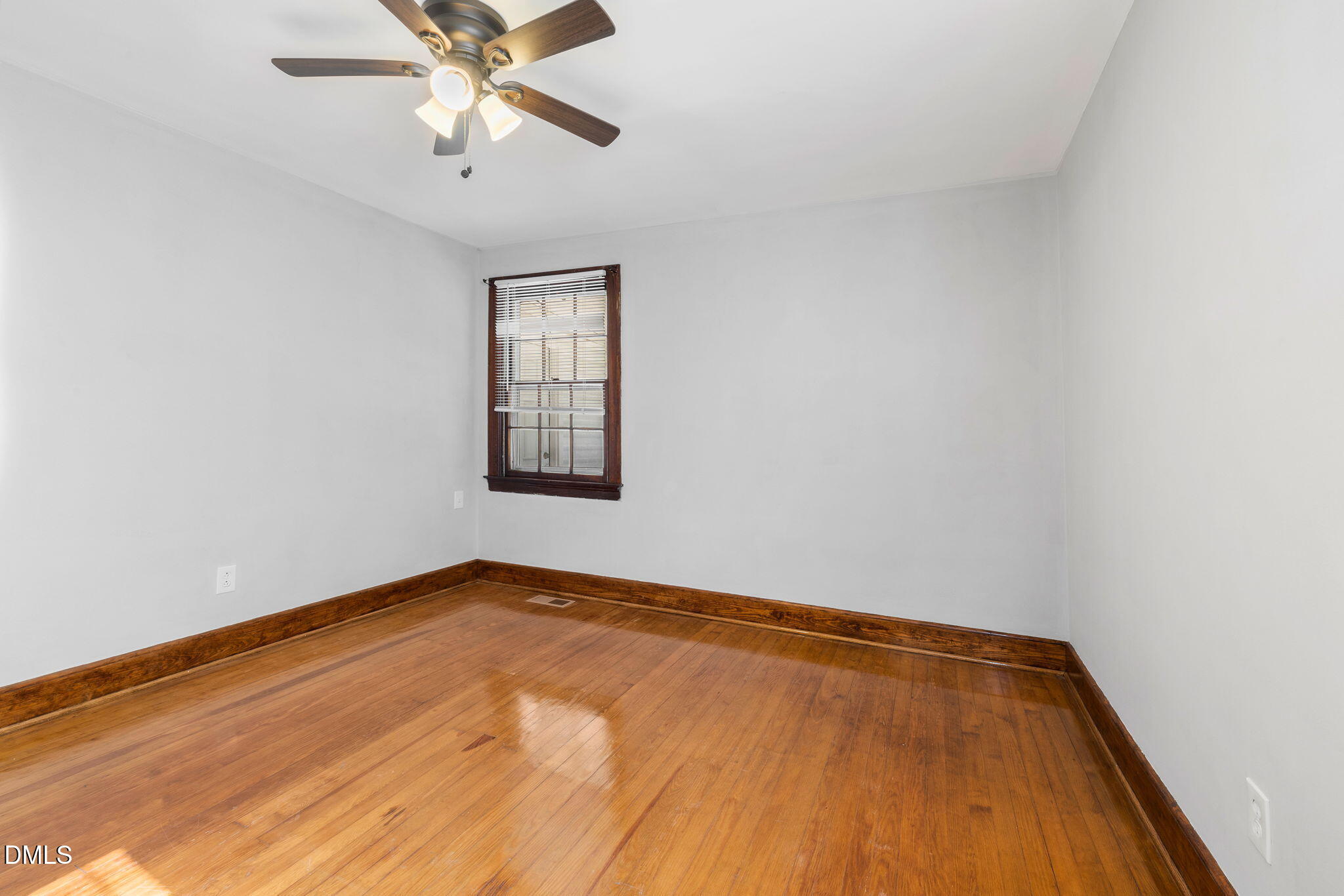 109 Lincoln Court Raleigh, NC 27610 - Photo 20 of 27 wooden floor in an empty room with a window