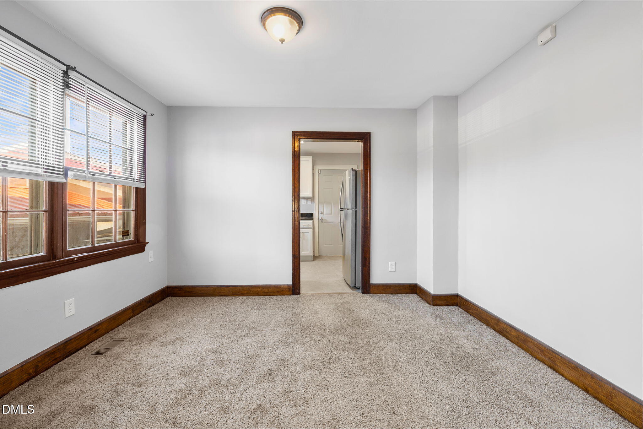 109 Lincoln Court Raleigh, NC 27610 - Photo 7 of 27 an empty room with windows