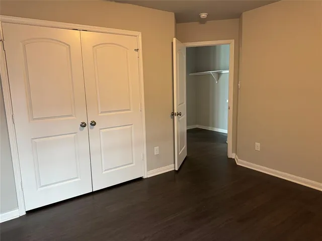 an empty room with wooden floor